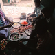 A group of people, including several kothis prepare food at Sivagami’s house. For many of the kothis, who live with their families, being able to prepare and serve food—considered to be “women’s work” is a way for them to express part of their female identity.